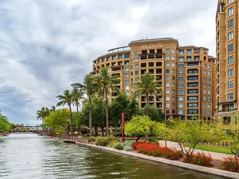 Palms, flowers and buildings along the Arizona Canal at the Scottsdale Waterfront
