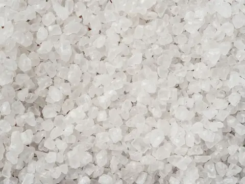 Coarse white salt crystals up close